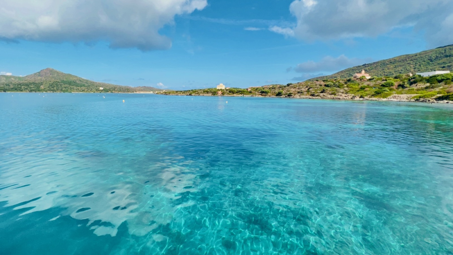 Crystal-clear water in a bay along Asinara's coastline