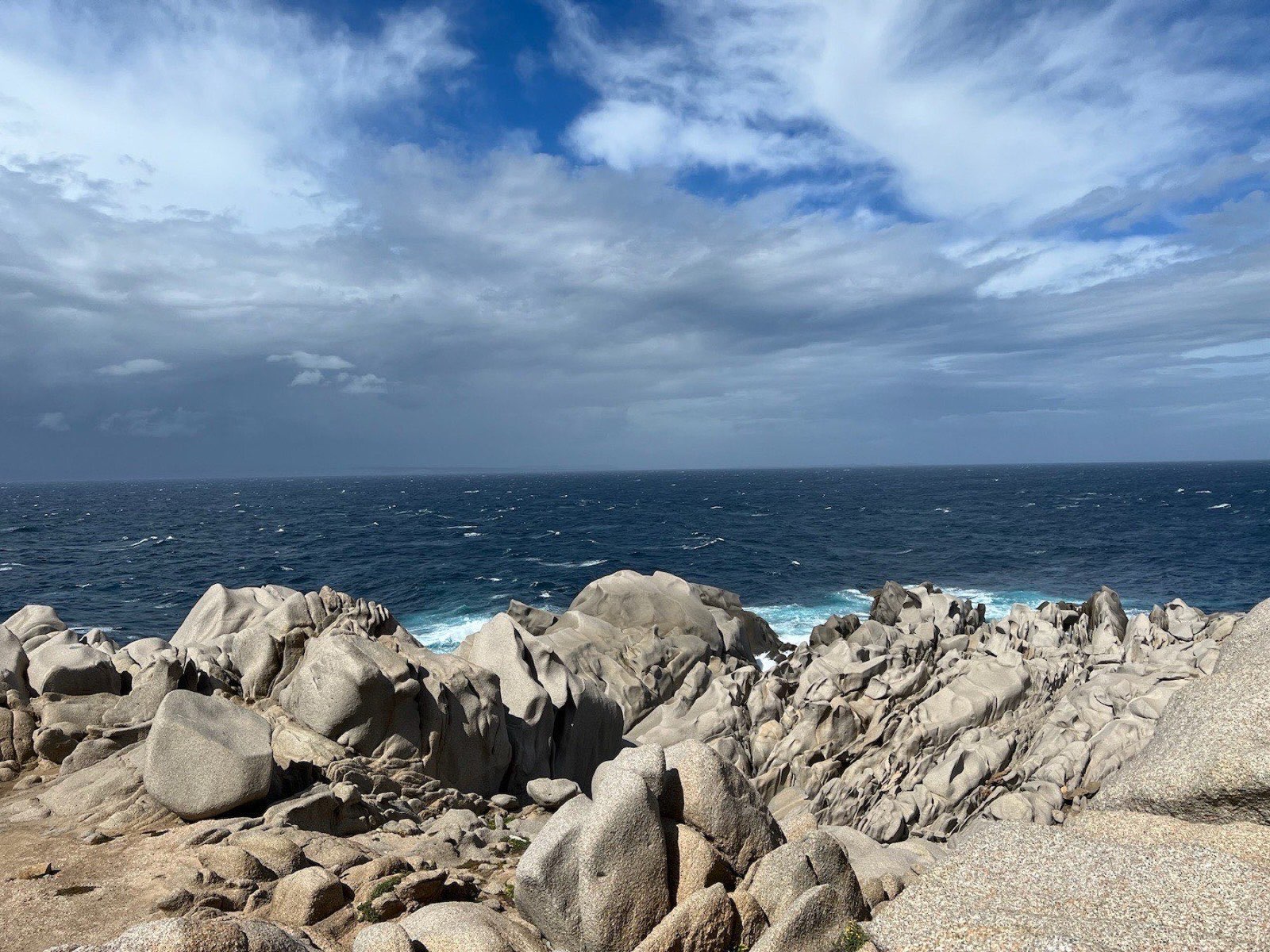 A small swimming cove between the wind-sculpted granite of Capo Testa