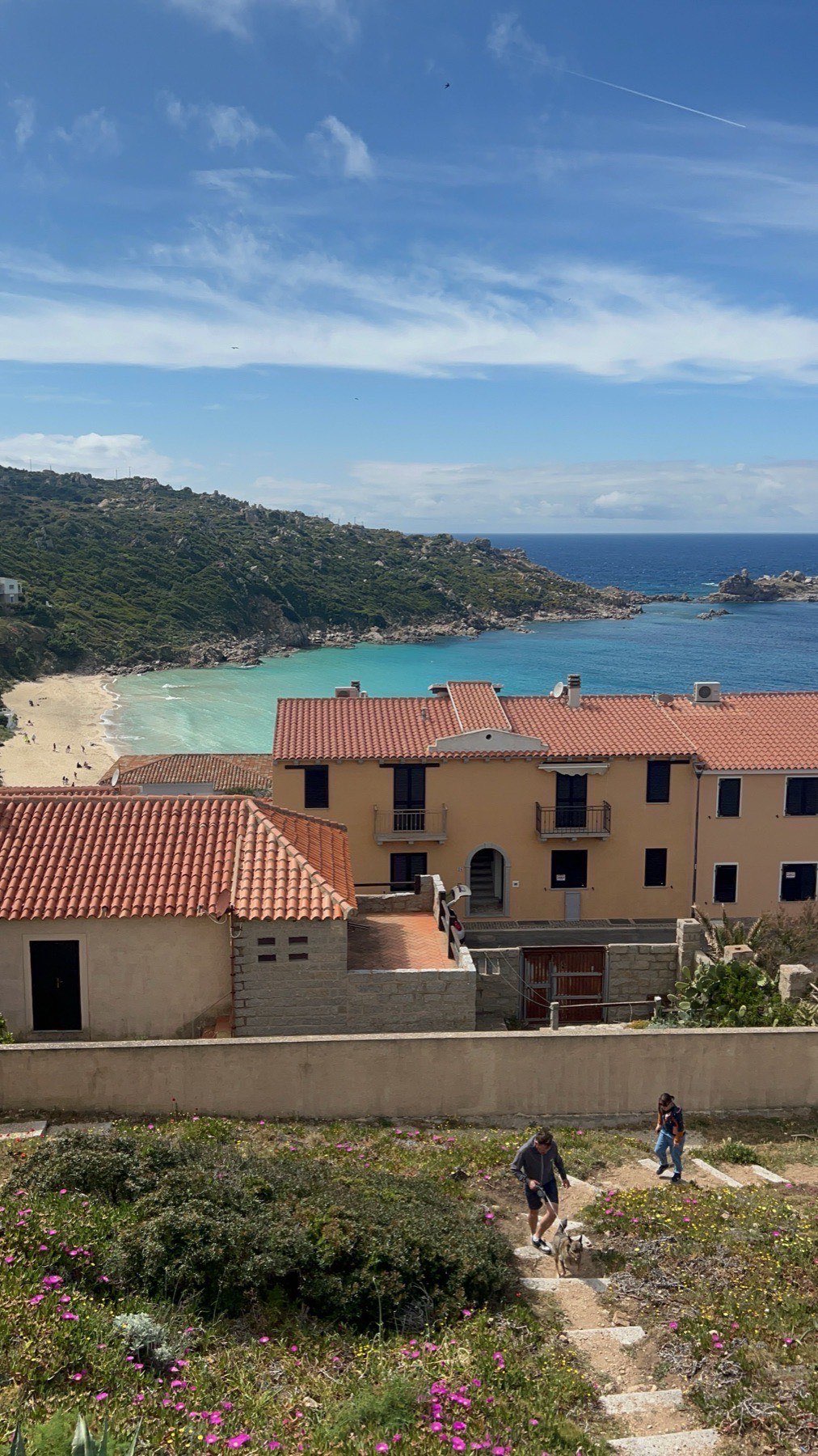Clifftop view down to Rena Bianca beach from the Santa Teresa headland