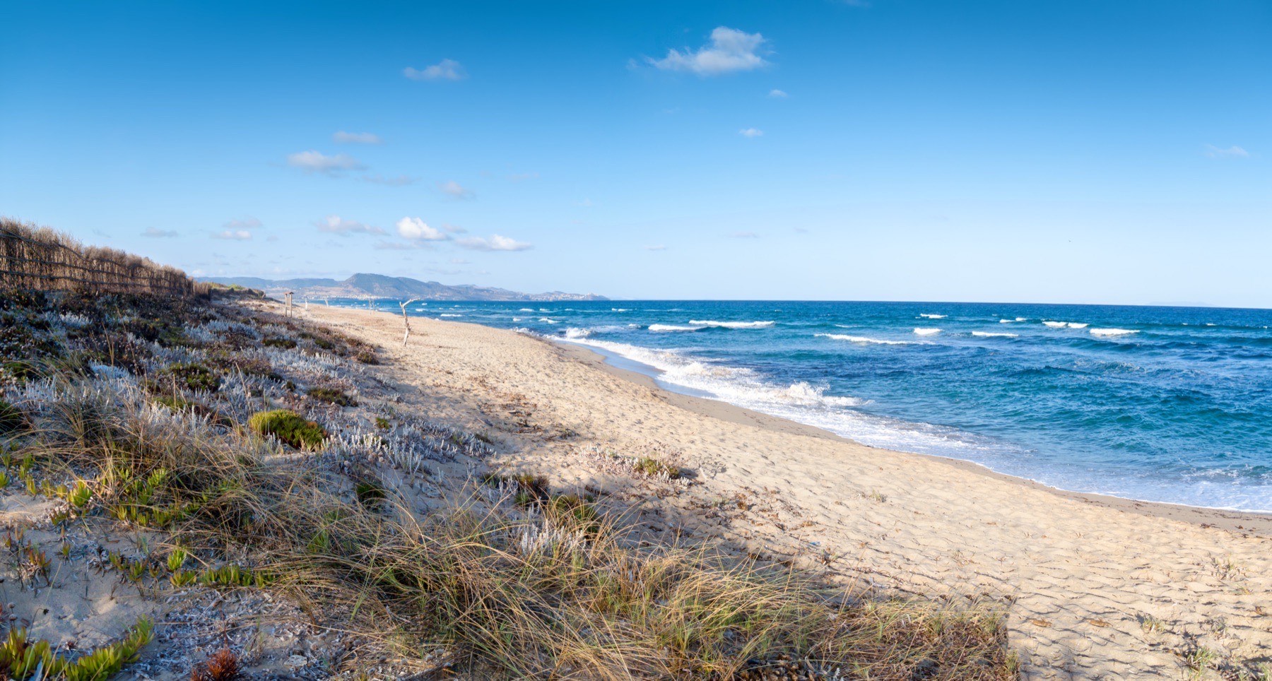 Wide stretch of Li Junchi beach at Badesi