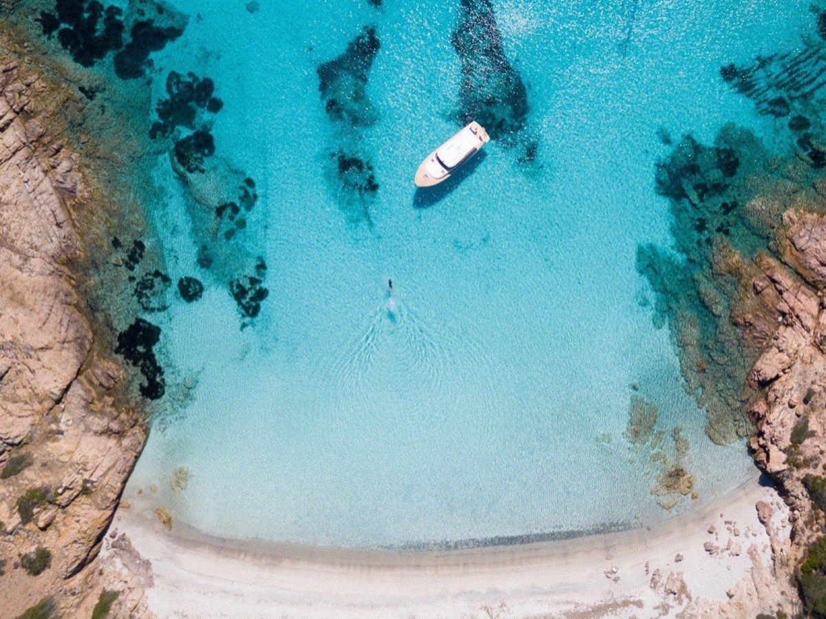 Aerial of a boat in front of Mortorio island, Costa Smeralda